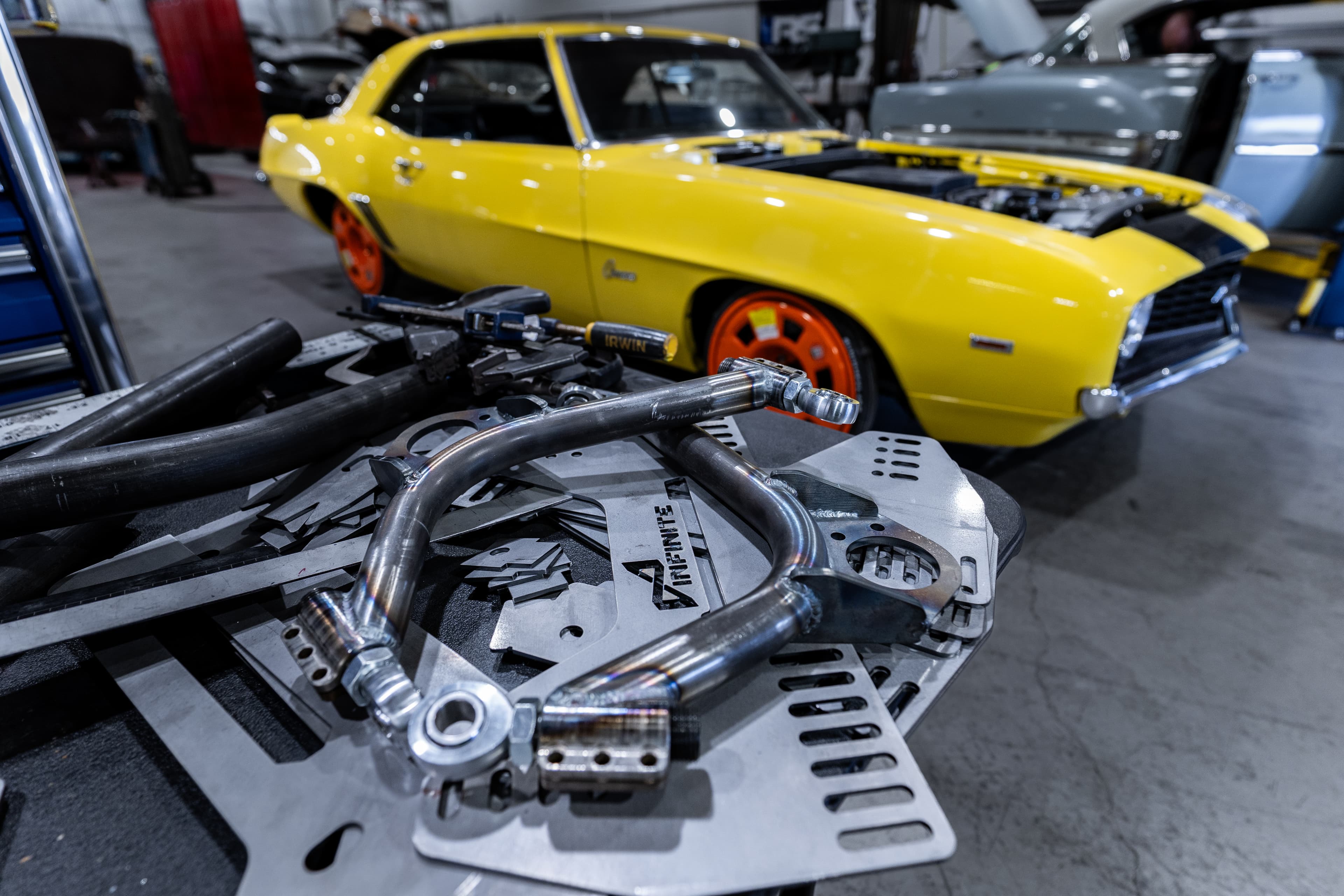 Infinite Fab Works shop, Camaro in the bay with custom suspension